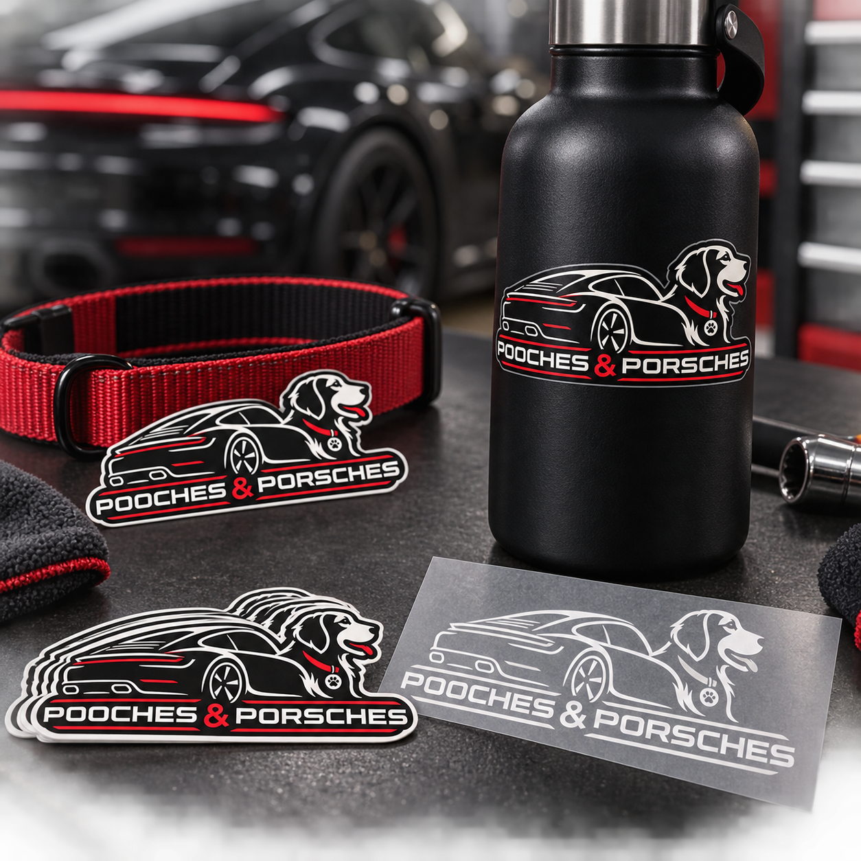 Pooches and Porsches die-cut stickers and vinyl decal in an automotive studio